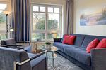 Wohnzimmer mit Sessel - Wohnung 01 - Top-Hundeurlaub