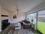 Wohnzimmer - Ferienwohnung Ostwind Neßmersiel - Top-Hundeurlaub