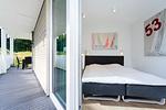 drittes Schlafzimmer mit Eingang zur Terrasse - Wohnung 01 - Top-Hundeurlaub