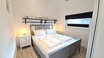 Schlafzimmer - Ferienhaus "Rachel III" im Ferienpark Holm an der Ostsee - Top-Hundeurlaub