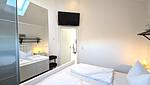 Schlafzimmer - Ferienhaus "Rachel III" im Ferienpark Holm an der Ostsee - Top-Hundeurlaub