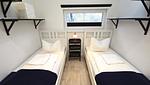 Schlafzimmer - Ferienhaus "Rachel III" im Ferienpark Holm an der Ostsee - Top-Hundeurlaub