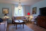 Wohnbereich mit Sitzecke im historischen Schwedenhaus in Ryd - Milleboda - Top-Hundeurlaub
