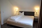 Schlafzimmer - Haus Nr. 26, Ferienhaus Fischerhus - Top-Hundeurlaub