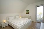 Schlafzimmer - Haus: Terrasse, Balkon, eigene Sauna, Sauna - und Schwimmbadnutzung - Top-Hundeurlaub