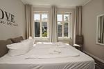 Schlafzimmer - FeWo1: Balkon,Sauna,Schwimmbad - Top-Hundeurlaub