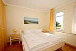 Schlafzimmer - FeWo44: Terrasse, Sauna, Schwimmbad - Top-Hundeurlaub