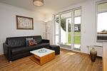 Wohnzimmer - FeWo11: Terrasse, Sauna, Schwimmbad - Top-Hundeurlaub