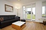 Wohnzimmer - FeWo11: Terrasse, Sauna, Schwimmbad - Top-Hundeurlaub