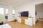 Wohnzimmer - FeWo11: Terrasse, Sauna, Schwimmbad - Top-Hundeurlaub