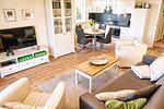Wohnzimmer - FeWo12: Terrasse, Sauna, Schwimmbad - Top-Hundeurlaub