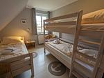 Schlafzimmer - Ferienhaus Ellen, OG Whg. - Top-Hundeurlaub