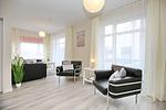 Wohnbereich mit Ecksofa und 2 Sesseln - Wohnung 43 - Top-Hundeurlaub