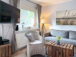 Wohnzimmer mit TV - Haus 32c - Top-Hundeurlaub