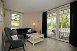 Wohnzimmer mit Schlafcouch und Sessel - Dorsch Wohnung 02 - Top-Hundeurlaub