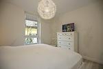 Schlafzimmer mit Doppelbett und TV - Dorsch Wohnung 02 - Top-Hundeurlaub