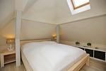 zweites Schlafzimmer mit Doppelbett im Dachgeschoss - Wohnung 06 - Top-Hundeurlaub