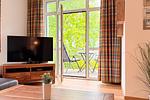 Wohnzimmer mit TV - Wohnung 03 - Top-Hundeurlaub
