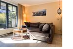 Wohnzimmer mit Sofaecke - Wohnung 09-3 - Top-Hundeurlaub