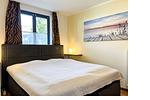 Schlafzimmer mit Doppelbett - Wohnung 09-3 - Top-Hundeurlaub