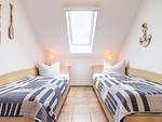 Schlafzimmer mit zwei Einzelbetten - Wohnung 5-73 - Top-Hundeurlaub