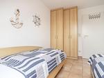 Schlafzimmer mit zwei Einzelbetten - Wohnung 5-73 - Top-Hundeurlaub