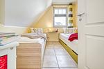 Schlafzimmer mit zwei Einzelbetten - 23 - Wohnung Boddenstern - Top-Hundeurlaub