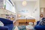 Schlafzimmer mit Doppelbett und Sitzecke - Neue Reihe 28 - Wohnung Vogelnest - Top-Hundeurlaub