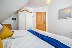 Schlafzimmer mit Doppelbett - Doppelhaushälfte 9a - Leuchtturm - Top-Hundeurlaub