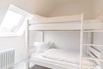 Deichlodge, Lodge.drei, Schlafzimmer 2 mit Etagenbett - deichlodge, lodge.drei - Top-Hundeurlaub