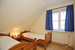 erstes Schlafzimmer mit Einzelbetten - Wohnung 15-5 - Top-Hundeurlaub