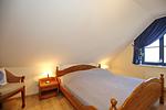 zweites Schlafzimmer mit Doppelbett - Wohnung 15-5 - Top-Hundeurlaub