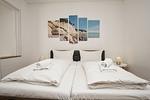 Schlafzimmer - FeWo 01: Terrasse und Gartennutzung, Sauna- u. Schwimmbadnutzung - Top-Hundeurlaub