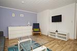 Wohnzimmer - Ferienhaus: Terrasse und Gartennutzung, Sauna- u. Schwimmbadnutzung - Top-Hundeurlaub