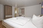 Schlafzimmer - Ferienhaus: Terrasse und Gartennutzung, Sauna- u. Schwimmbadnutzung - Top-Hundeurlaub