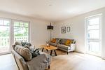 Wohnzimmer mit Couch und Sesseln - Wohnung 04 - Top-Hundeurlaub