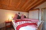 Schlafzimmer - Bunte Kuh -  Feriendorf Via Claudia Haus 52 - Top-Hundeurlaub