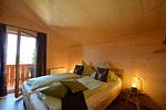 Schlafzimmer - Waldromantik - Feriendorf Via Claudia Haus 75 - Top-Hundeurlaub