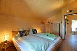 Schlafzimmer - Waldromantik - Feriendorf Via Claudia Haus 75 - Top-Hundeurlaub