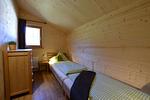 Schlafzimmer - Waldromantik - Feriendorf Via Claudia Haus 75 - Top-Hundeurlaub