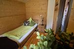 Schlafzimmer - Waldromantik - Feriendorf Via Claudia Haus 75 - Top-Hundeurlaub