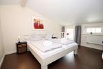 Schlafzimmer Obergeschoss - Haus Knurrhahn, Susanne-Fischer Weg 39 - Top-Hundeurlaub