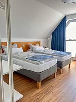 Schlafzimmer - Ferienhaus Seeperle Traumblick 7a - Top-Hundeurlaub