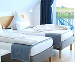 Schlafzimmer - Ferienhaus Seeperle Traumblick 7a - Top-Hundeurlaub