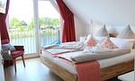 Schlafzimmer - Ferienhaus Seeperle Traumblick 7a - Top-Hundeurlaub