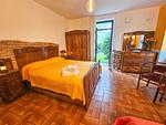 großes rustikales Schlafzimmer mit Zugang zum Garten - Appartment I Giardino - Top-Hundeurlaub