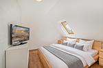 Schlafzimmer - Ferienwohnung Am Bahnhof mit 2 Bädern und nur 700 m zum Strand - Top-Hundeurlaub