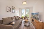 Wohnzimmer - Ferienwohnung Haffkoje Fitness, Sauna und Kinderspielbereich - Top-Hundeurlaub