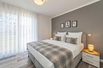Schlafzimmer - Ferienwohnung Haffkoje Fitness, Sauna und Kinderspielbereich - Top-Hundeurlaub