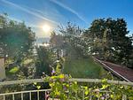 Blick auf Garten und See - Ferienwohnung Idylle am See - Top-Hundeurlaub